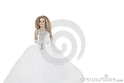 Bride girl holding crucifix wearing wedding gown over white background Stock Photo