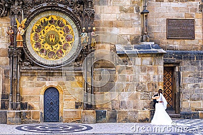 The bride and groom on the background of the famous astronomical Editorial Stock Photo