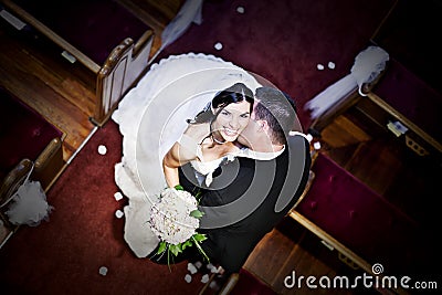 Bride and groom in a church Stock Photo