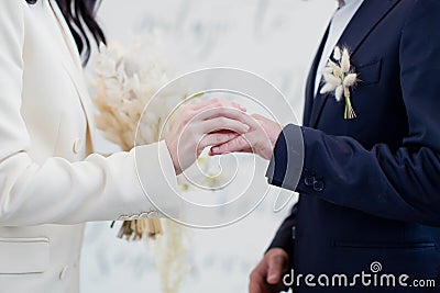 Bride and groom exchange wedding rings Stock Photo