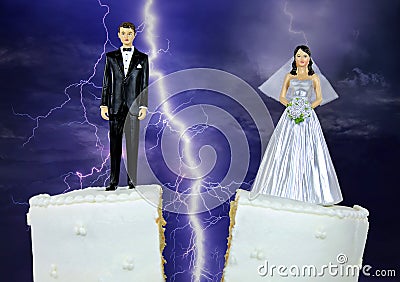 Bride and groom on split wedding cake Stock Photo