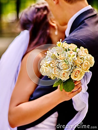 Bride and groom giving flower outdoor Stock Photo