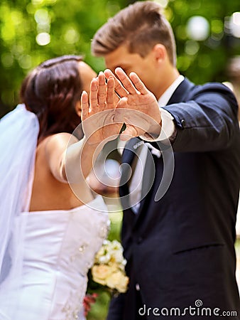 Bride and groom giving flower outdoor Stock Photo