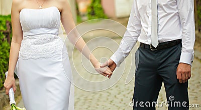 Bride and groom hands Stock Photo