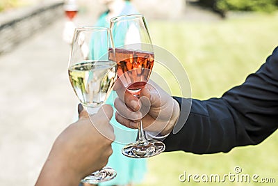 Bride and groom holding beautifully wedding glasses with champaign sparkling wine toast Stock Photo