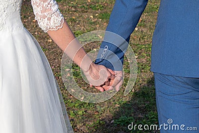 Bride and groom holding hands Stock Photo