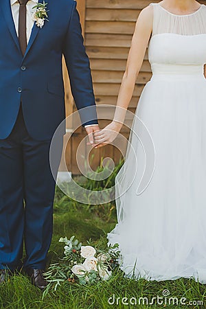 Bride and groom holding hands Stock Photo