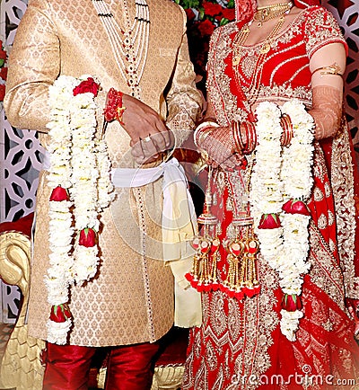 Bride and groom at the Indian wedding garlands or Jaimala ceremony Stock Photo