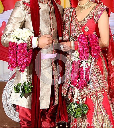 Bride and groom at the Indian wedding garlands or Jaimala ceremony Stock Photo