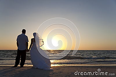 Bride & Groom Married Couple Sunset Beach Wedding Stock Photo