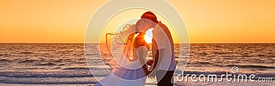 Bride and Groom Married Couple Sunset Beach Wedding Panorama Stock Photo