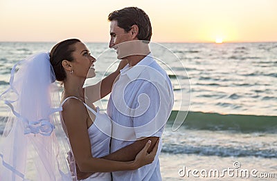 Bride and Groom Married Couple Sunset Beach Wedding Stock Photo