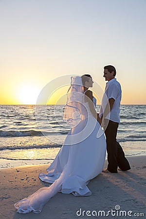 Bride & Groom Married Couple Sunset Beach Wedding Stock Photo