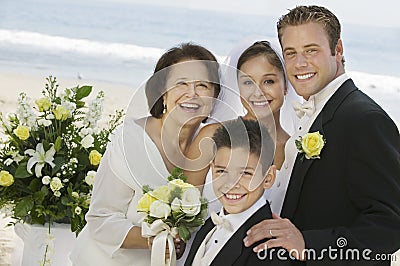 Bride and Groom with mother and brother outdoors (portrait) Stock Photo