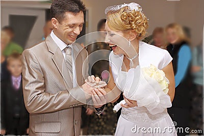 The bride and groom rejoice. Exchange wedding rings during the wedding Stock Photo