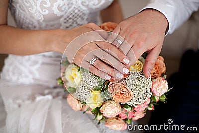 Bride and groom`s hands with wedding rings. Close-up Stock Photo
