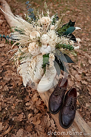 bride and groom shoes, wedding bouquet outdoor. Stock Photo