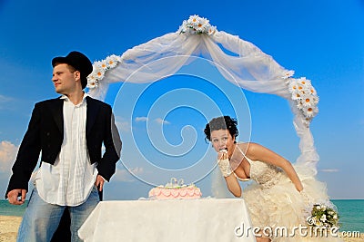 Bride and Groom with wedding cake Stock Photo