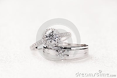 Bride and groom wedding engagement rings on white background Stock Photo