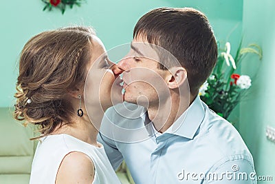 Bride and groom in a white dress kissing Stock Photo