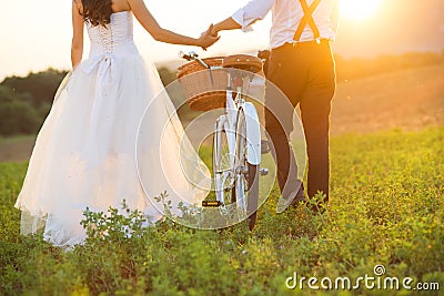 Bride and groom with a white wedding bike Stock Photo