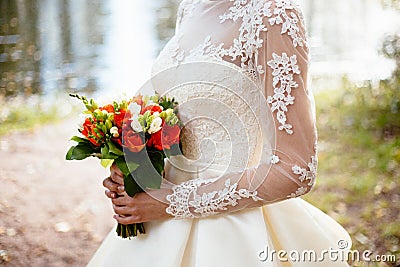 Bride holding big wedding bouquet on wedding ceremony Stock Photo