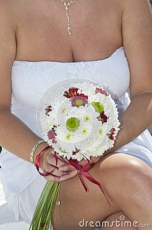 Bride holding a flower posy Stock Photo