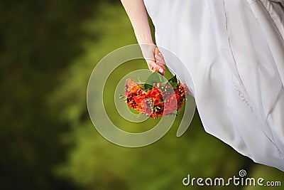 The bride holds a wedding bouquet orange Stock Photo