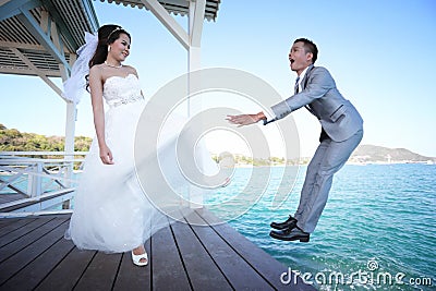Bride kicking a Bridegroom,Pre Wedding photography thai couples Stock Photo
