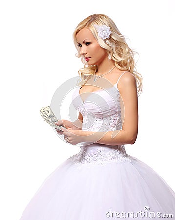 Bride with money. holding and counting dollars bills. beautiful blonde young woman isolated Stock Photo