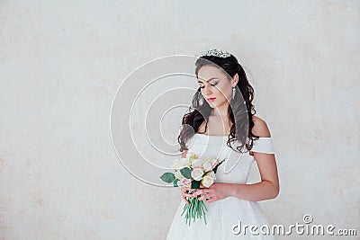 Bride Princess stands in a wedding dress with flowers Stock Photo