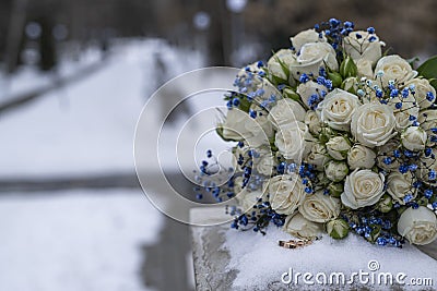 Bride's wedding bouquet lies on a stone slab Stock Photo