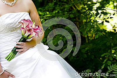 Bride showing off her wedding bouquet Stock Photo