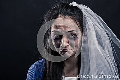 Bride with tear-stained face on black background Stock Photo