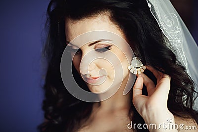 Bride trying on jewelry close-up Stock Photo