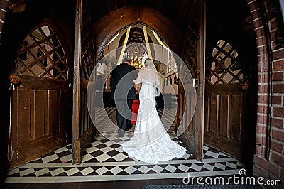 Bride walking down aisle with father Stock Photo