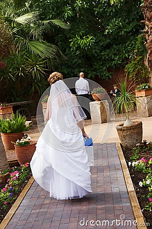 Bride walking to groom Stock Photo