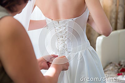 Bride wearing wedding dress Stock Photo