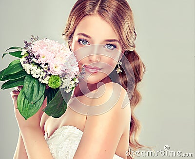 Bride in wedding dress with flower bouquet. Stock Photo