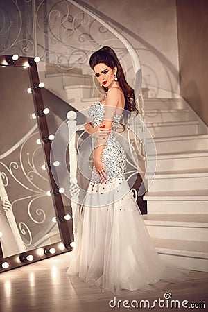Bride in wedding dress in luxurious interior. Elegant brunette l Stock Photo