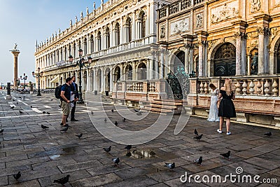 A bride in a white dress prepares for her wedding shooting on St. Mark`s Square in Venice. Venice in the early morning Editorial Stock Photo