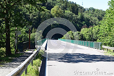 Bridge across the reservoir lake of river Our near Vianden Stock Photo