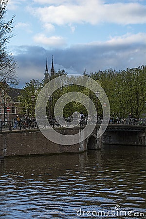 Bridge with bikes and lanterns in the twilight Stock Photo