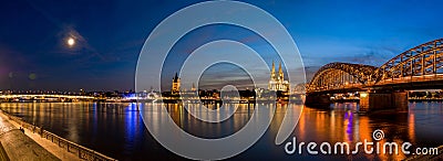 Bridge and Cathedral of Cologne, Germany after sunset in blue hour panorama Stock Photo