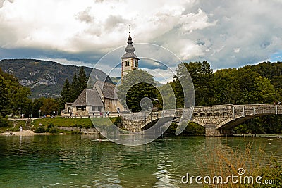 bridge and church in RibÄev Laz a cosy village at the end of the Bohinj lake Stock Photo