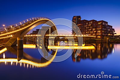 A bridge in the city at night. City lights. The Galaxy Bridge, Purmerend, Netherlands. Stock Photo