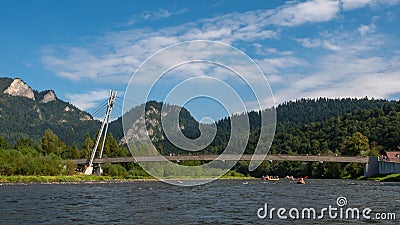 Bridge connecting Poland and Slovakia on the Dunajes River. Sromowce Nizne. Stock Photo