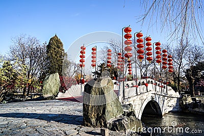 A Bridge in a Historic Traditional Garden of Beijing, China in winter, during Chinese New Year Editorial Stock Photo