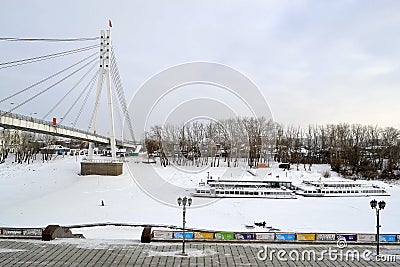 The bridge of lovers through the Tura River and the embankment i Editorial Stock Photo