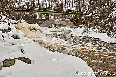 Bridge, old dam and waterfall Stock Photo